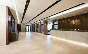 a lobby of a hotel with a reception desk at Hotel Mfelice in Seoul