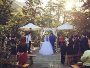 a bride and groom walking down the aisle at their wedding at Onai Hostel in Las Trancas