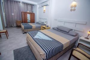 En eller flere senge i et værelse på Seeya's Villa, your Home away from Home