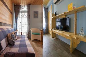 una camera con letto e TV di Tobe Home a Luodong