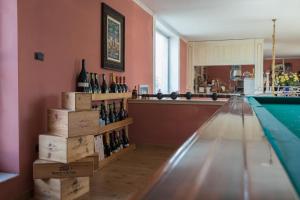 a room with a pool table and bottles of wine at filobrocante in Torre Santa Susanna +45 photos