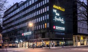 a building with a sign on the side of it at Original Sokos Hotel Seurahuone Kotka in Kotka