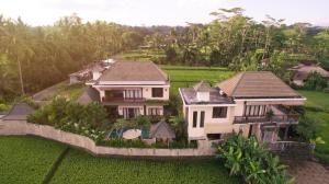 an aerial view of a house in a green field at Alosta Luxury Private Villa in Ubud