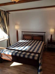 a bedroom with a bed in a room with a window at Nojus in Nida +12 photos