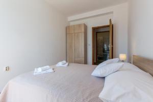 Postel nebo postele na pokoji v ubytování Apartment Sea to Sky Dubrovnik
