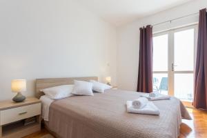 Postel nebo postele na pokoji v ubytování Apartment Sea to Sky Dubrovnik