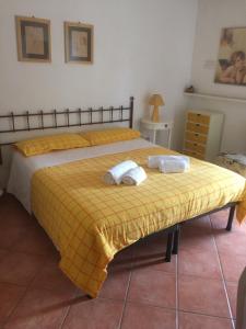 a bedroom with two beds with towels on them at Villa Franca in Pula