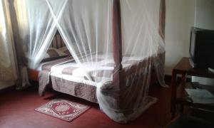 Letto o letti in una camera di Skyway Hotel