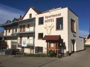 a hotel with a deer head on the side of it at Gasthof zum Ochsen in Mössingen