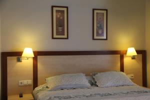 A bed or beds in a room at UzHan Beach Hotel