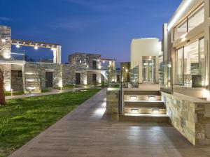 an exterior view of a house with a pathway at Golden Sun Resort - Adults Only in Kalamaki