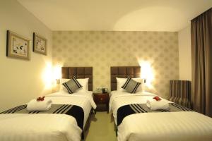 Uma cama ou camas num quarto em Hotel Permata Bogor