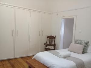 Ένα ή περισσότερα κρεβάτια σε δωμάτιο στο Die Hoekhuis +1 φωτογραφίες