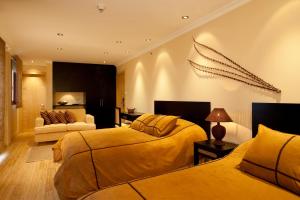 Ένα ή περισσότερα κρεβάτια σε δωμάτιο στο Ikala Quito Hotel
