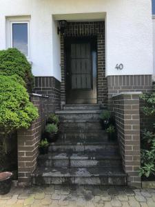 a front door of a house with stairs at K House 5* Apartments in Kaufungen