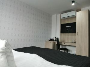 Łóżko lub łóżka w pokoju w obiekcie Willa Sandomierska