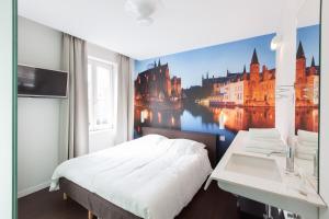 Voodi või voodid majutusasutuse Hotel Marcel toas