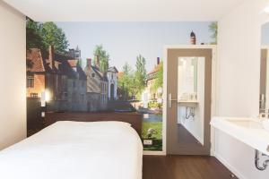 Voodi või voodid majutusasutuse Hotel Marcel toas