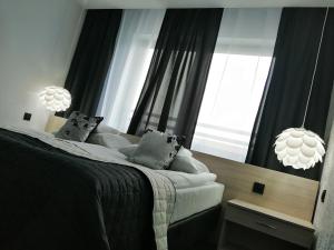 Łóżko lub łóżka w pokoju w obiekcie Willa Sandomierska
