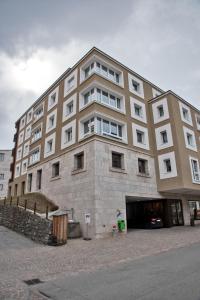 a large building with a lot of windows at Chesa Chalavus - St. Moritz in St. Moritz
