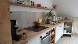 a small kitchen with a sink and a stove at Gramke/Henkel Quellenburgstraße in Sprockhövel