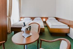 Postelja oz. postelje v sobi nastanitve Château Liblice