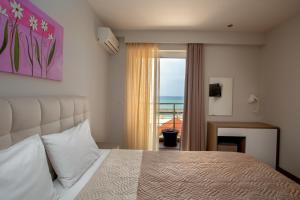 Posteľ alebo postele v izbe v ubytovaní Irini Hotel