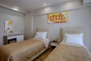 Posteľ alebo postele v izbe v ubytovaní Irini Hotel