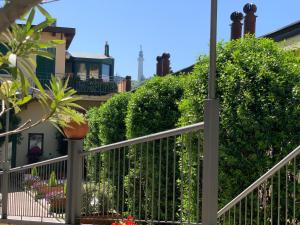 a fence in front of a house with plants at Le Residenze dei Serravallo in Trieste