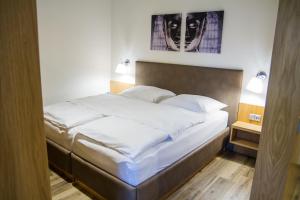 Postel nebo postele na pokoji v ubytování APART U LVA
