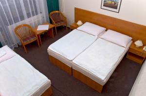 Hotel Adamantino客房内的一张或多张床位