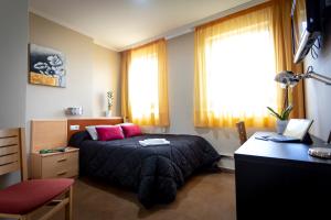 Postel nebo postele na pokoji v ubytování Hostal Campestre