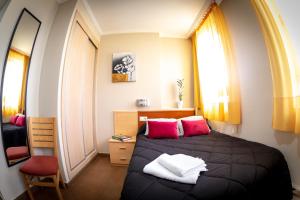 Postel nebo postele na pokoji v ubytování Hostal Campestre