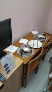A television and/or entertainment centre at Park Hotel Campitelli