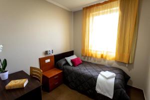Postel nebo postele na pokoji v ubytování Hostal Campestre