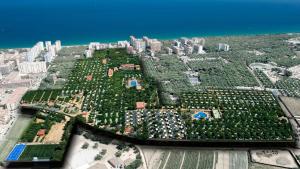 an aerial view of a city with trees and buildings at Glamping Blanes in Blanes