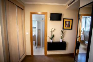TV a/nebo společenská místnost v ubytování Hostal Campestre