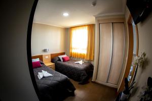 Postel nebo postele na pokoji v ubytování Hostal Campestre