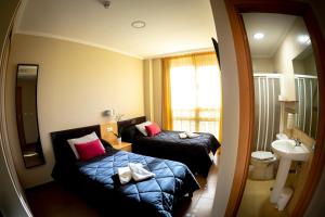 Postel nebo postele na pokoji v ubytování Hostal Campestre