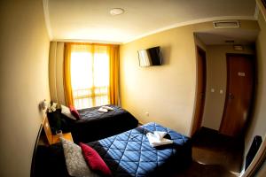 Postel nebo postele na pokoji v ubytování Hostal Campestre
