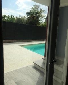 The swimming pool at or close to DEPENDANCE LAZISE LAGO DI GARDA