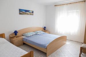 Ένα ή περισσότερα κρεβάτια σε δωμάτιο στο Apartments Beba