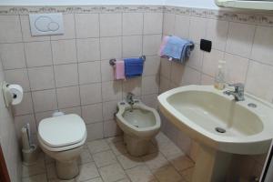 a bathroom with a toilet and a sink at Stanzetta del Cavaliere in Atrani