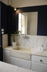 A bathroom at Mosaics aprtm in the Historical centre with Acropolis view