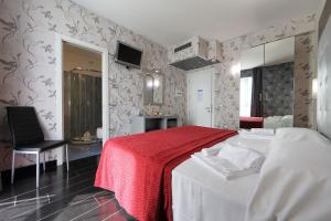Postel nebo postele na pokoji v ubytování Hotel Relax Roma Nord