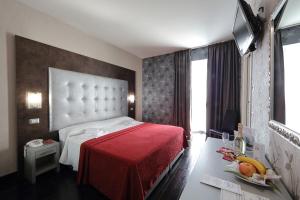 Postel nebo postele na pokoji v ubytování Hotel Relax Roma Nord + 37 fotografií