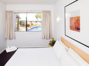 Ліжко або ліжка в номері Majestic Oasis Apartments