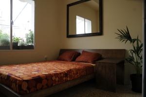 A bed or beds in a room at Mosaics aprtm in the Historical centre with Acropolis view
