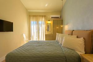 Posteľ alebo postele v izbe v ubytovaní Panas Hotel