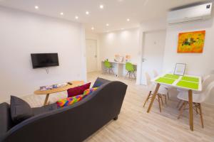 a living room with a couch and a table at Amazing Studio Apartment in Buenos Aires